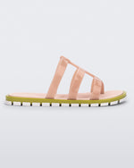 Side view of a pink Path adult sandal with  green sole