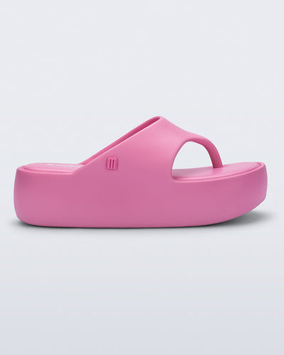Side view of a pink Free Platform Thong sandal