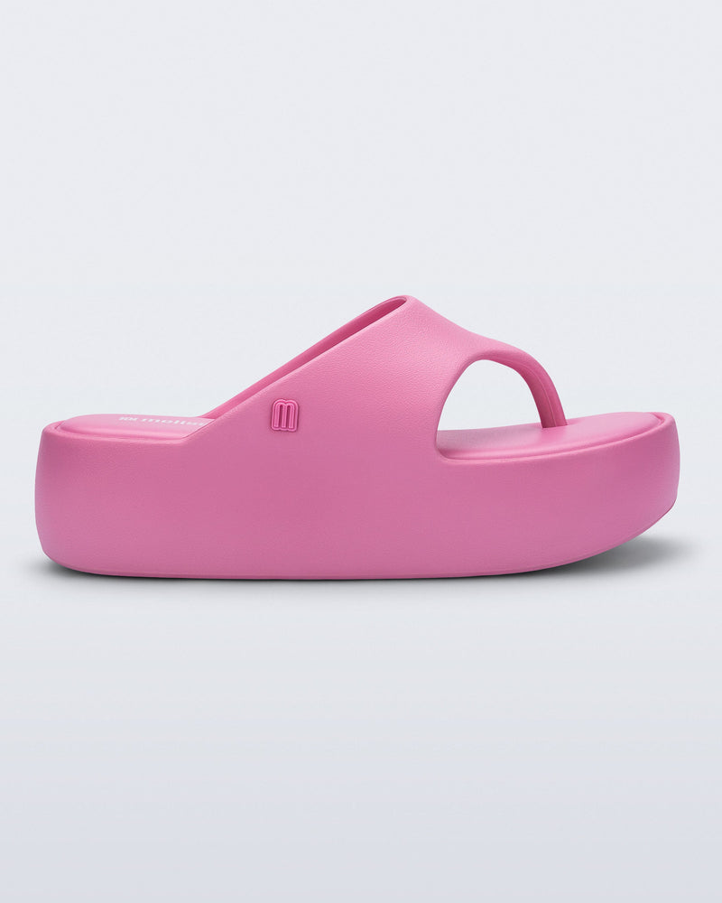 Side view of a pink Free Platform Thong sandal