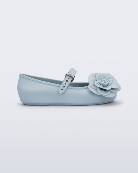 Side view of a blue Soft Ballerina Petals kids flat with flowers