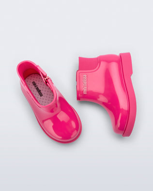 Top and side view of a pair of pink Chelsea II baby boots