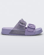 Side view of a lilac Mini Melissa Cozy slide with two front straps with buckle details