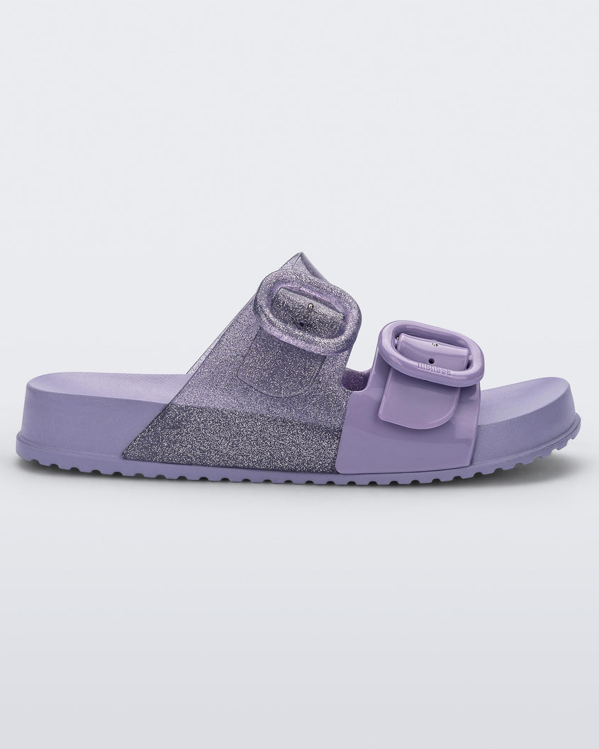 Side view of a lilac Mini Melissa Cozy slide with two front straps with buckle details