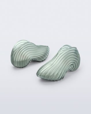 Back and angled view of a transparent green Quantum Sneakers + Diesel