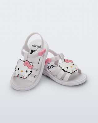 Angled view of a pair of white Hip + Hello Kitty and Friends sandals with Hello Kitty on upper