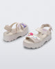 Back and angled view of a pair of beige Kick Off Sandals + Hello Kitty and Friends with Hello Kitty and Friends on the upper strap