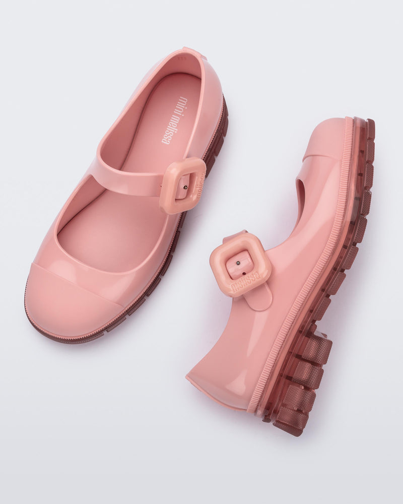 Top and side  view of a pair of pink June mary janes with matte toe cap