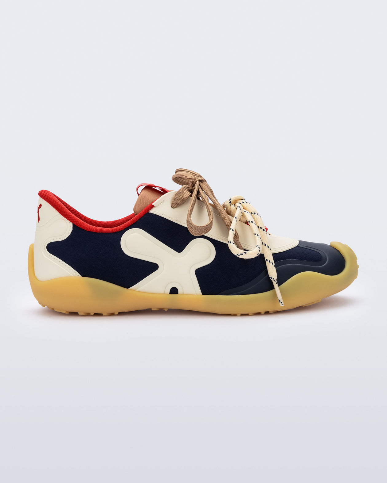 Side view of a black and beige X Bend sneaker with yellow sole