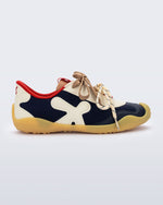 Side view of a black and beige X Bend sneaker with yellow sole