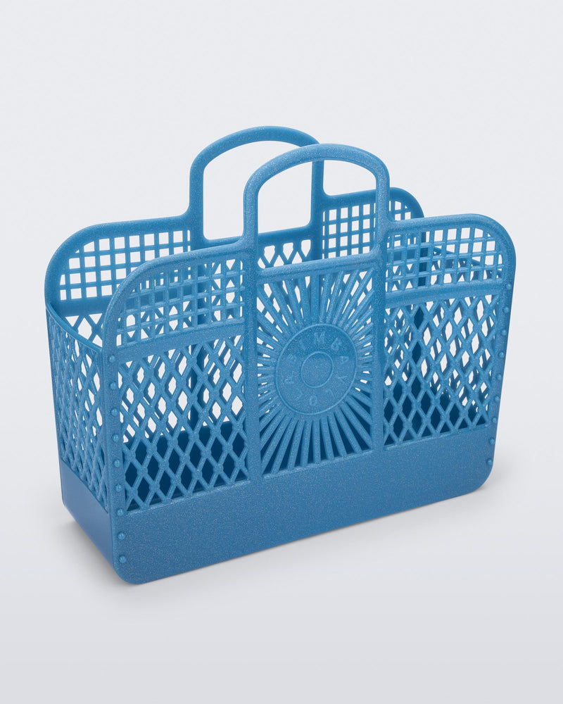 Angled view of the glitter blue Bag + Bimba y Lola