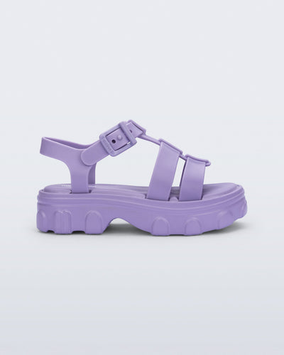 Side view of a lilac Ella kids sandal with heel strap