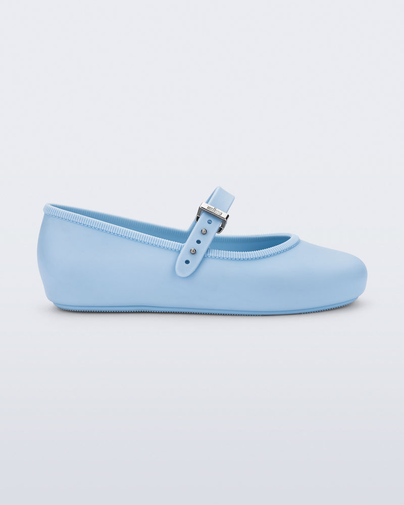 Side view of a pair of blue Soft Ballerina kids flat