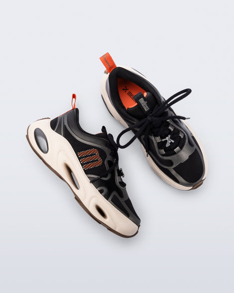 Top and side view of a pair of black X Loop sneakers with beige soles