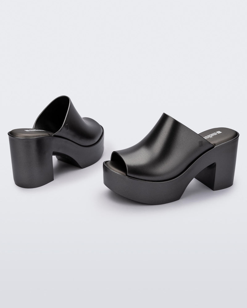 Angled view of a pair of dark silver Mule Hype Platforms
