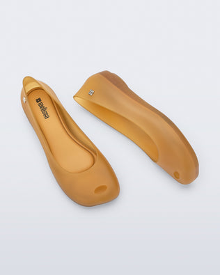 Side and top view of a pair of clear yellow Ultragirl Futura ballerina flats