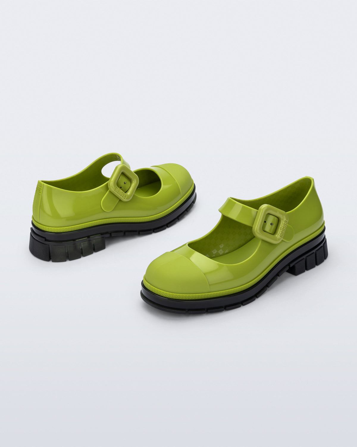 Back and side angle view of a pair of green with black sole June mary janes with matte toe cap
