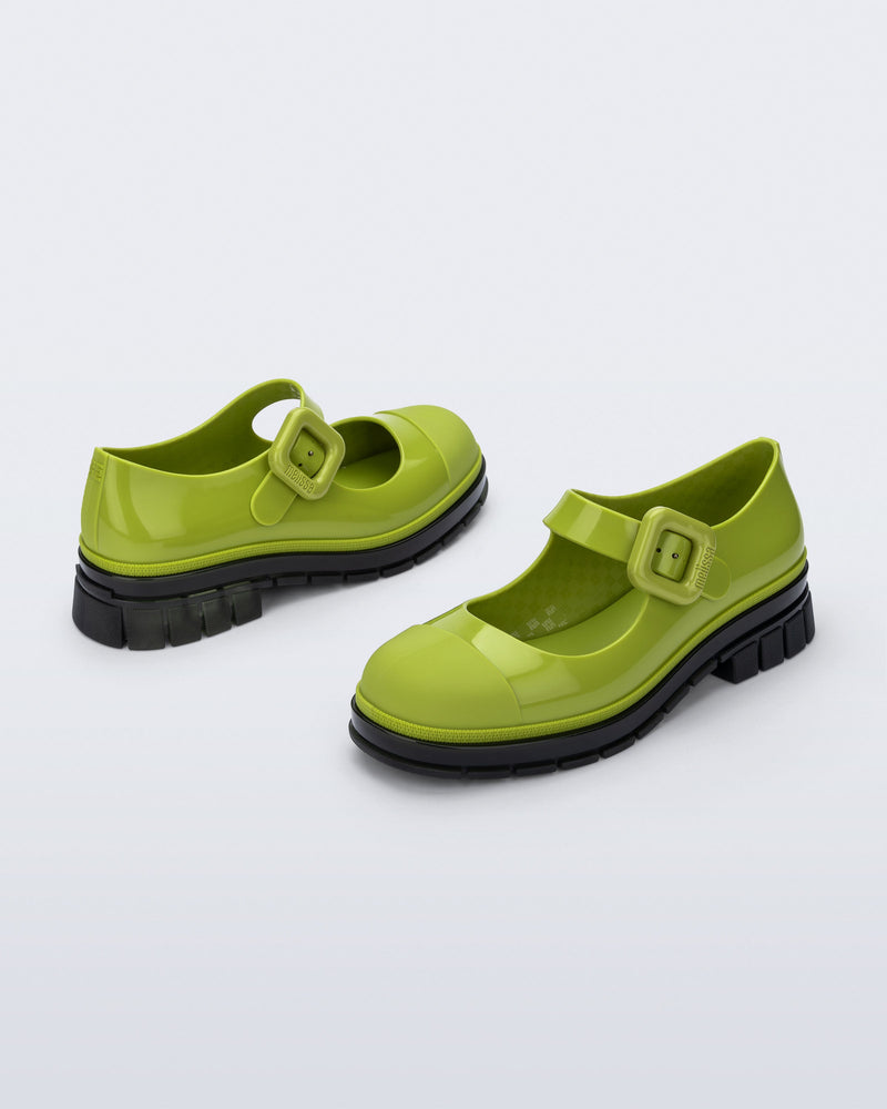 Back and side angle view of a pair of green with black sole June mary janes with matte toe cap