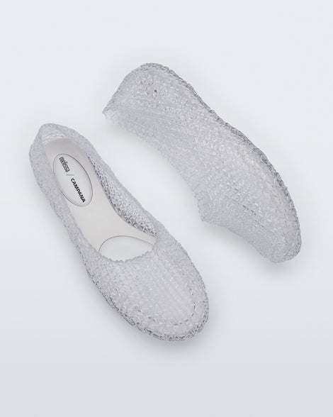 Top and side view of a pair of clear Campana Papel Hug flats