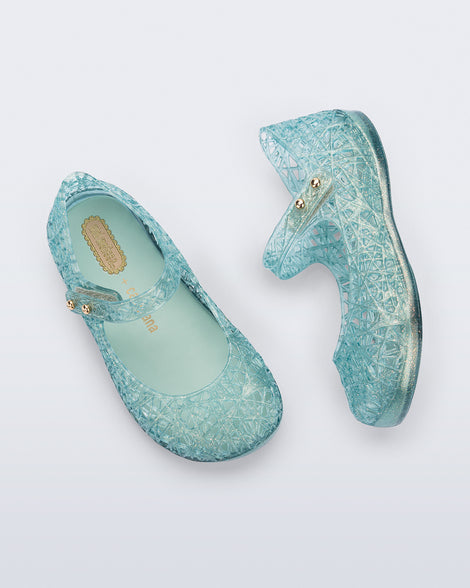 Top and side view of a pair of glitter blue green Campana Zip Zag baby flats