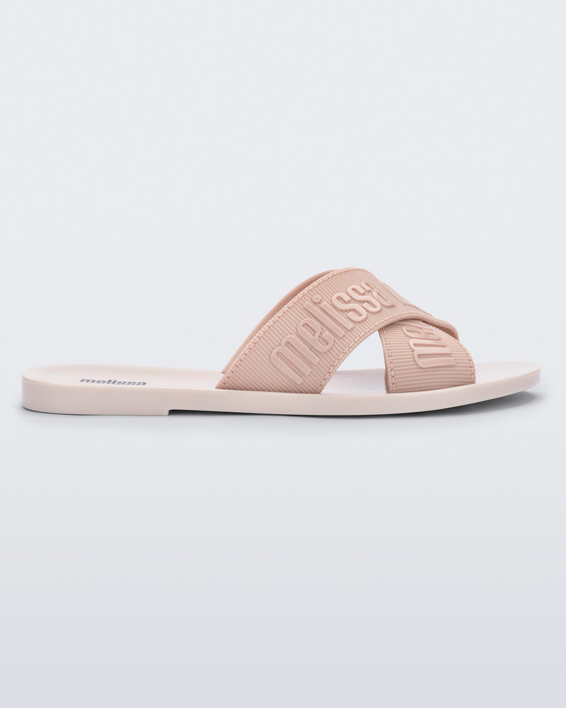 Side view of a beige M Lover adult slide