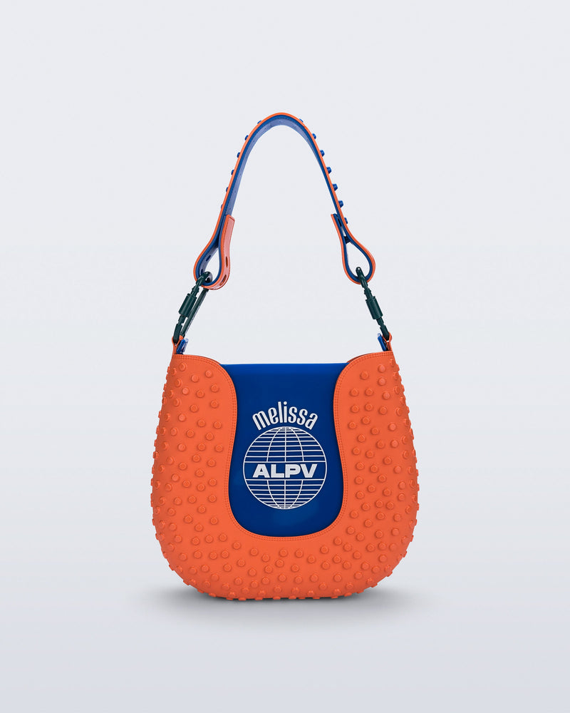 Back view of an orange Nina Bag + Alexandre Pavao shoulder bag with blue accents
