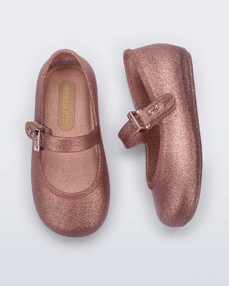 Top and side view of a pair of glitter pink Soft Ballerina baby flats