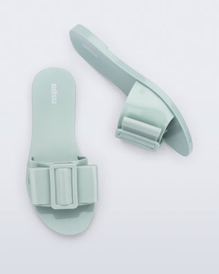 Top and side view of a pair of blue green Babe slide sandals