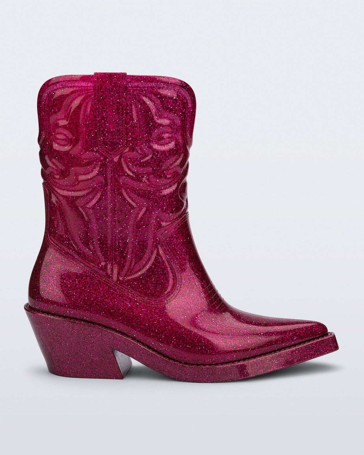 Side view of a glitter pink Texas boot with pointed toe.