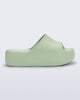 Side view of a light green Free Platform Slide sandal 