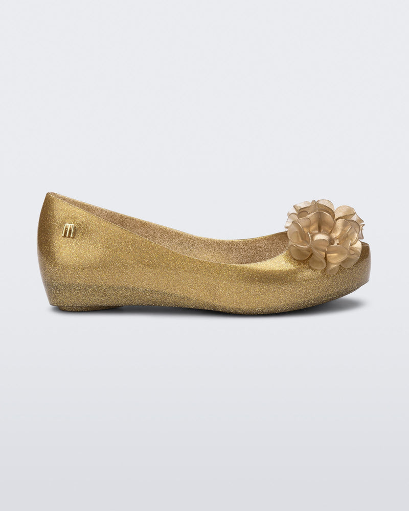 Side view of a glitter beige kids Ultragirl Springtime flats