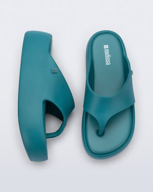 Side and top view of a pair of teal Free Platform Thong sandals