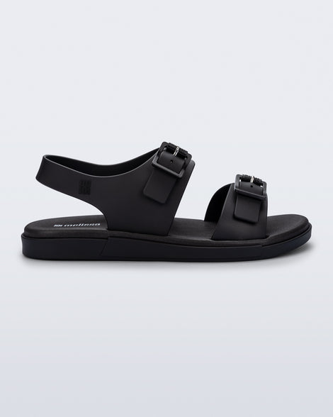 Side  view of a black Wave Sandal with two straps with buckles and a back strap