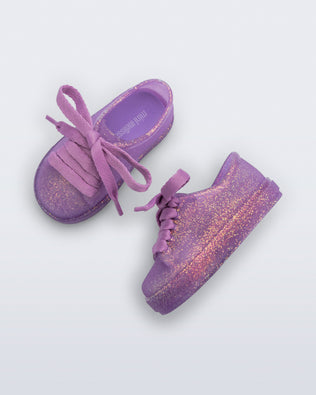 Side and top view of a pair of glitter lilac baby Hip Sneakers lilac laces
