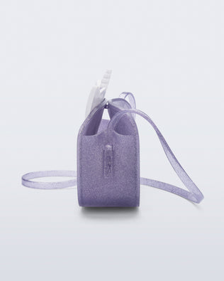 Side view of a lilac glitter Dreamy Unicorn kids bag with a unicorn face on front with pink hair