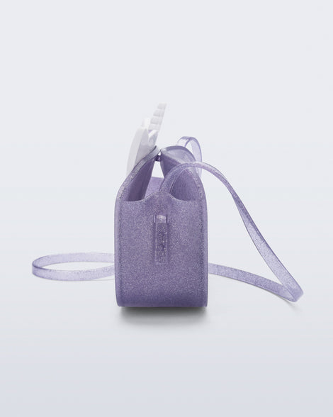 Side view of a lilac glitter Dreamy Unicorn kids bag with a unicorn face on front with pink hair