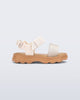 Side view of a beige/glitter Kick Off baby sandal