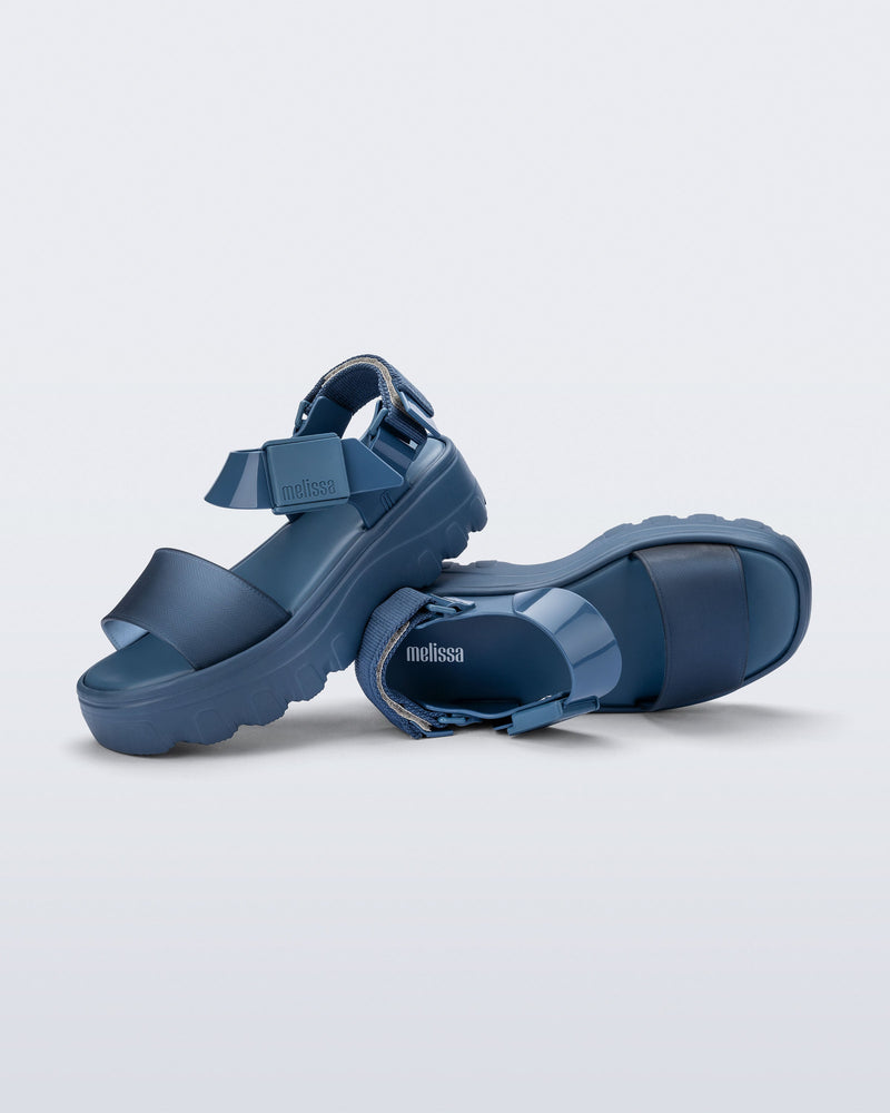 Top and side view of a pair of blue/blue Kick Off Sandals