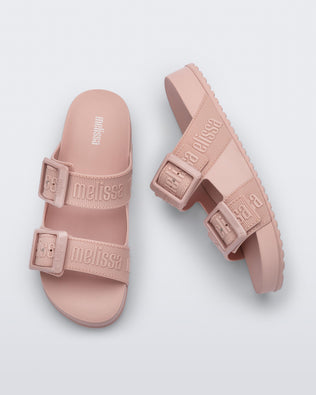 Top and side view of a pair of pink Cozy M Love adult slides