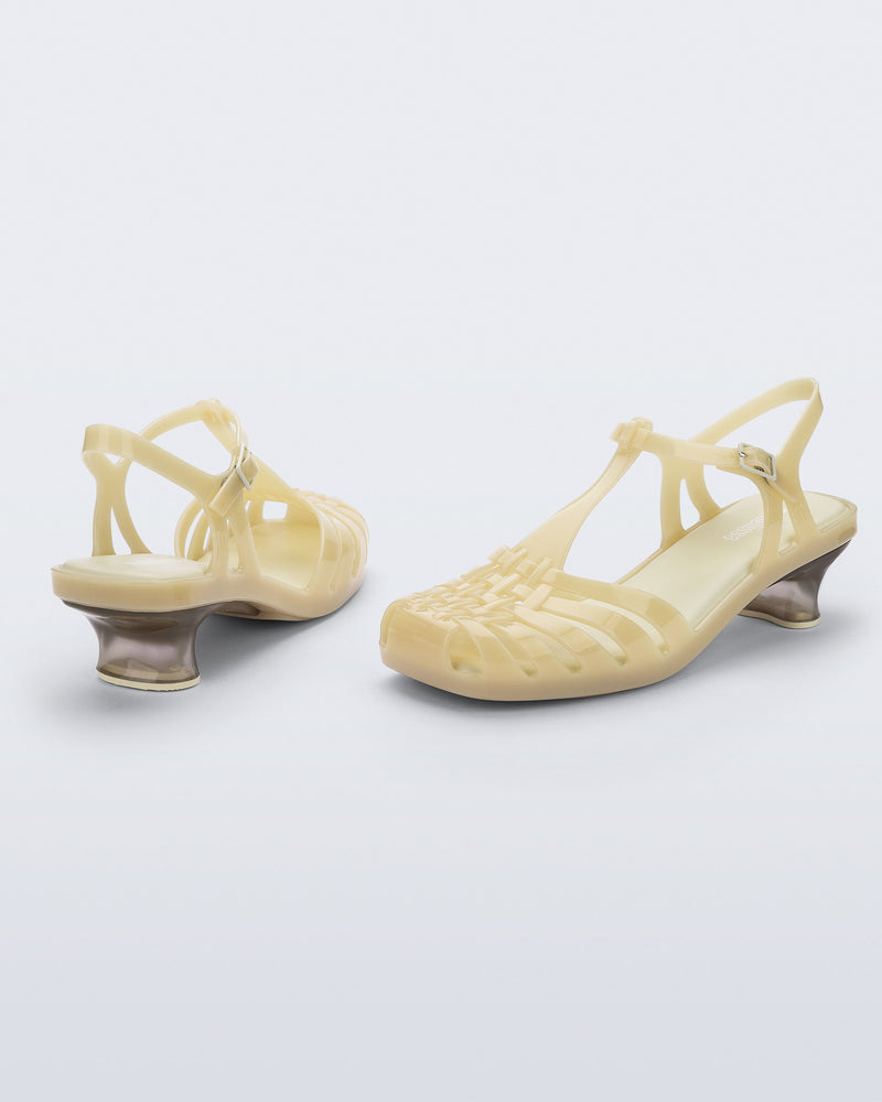 Back and side view of a pair of milky beige Vixen Kitten Heel sandals