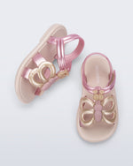 Side and angled view of a pair of pink strap, beige sole Hip Butterfly baby sandals