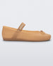 Side view of a Melissa Sophie ballet flat in beige with M-logo strap and bow applique
