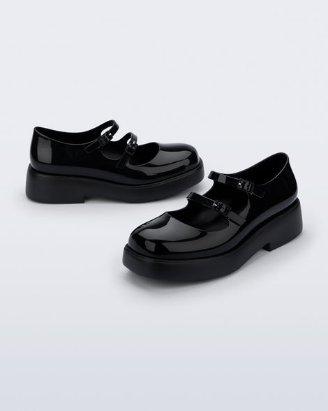 Side and angled view of a pair of black Farah Low Mary jane loafers