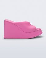 Side view of a pink Free Slip platform wedge heel