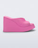 Side view of a pink Free Slip platform wedge heel