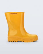 Side view of an orange Welly kids rainboot