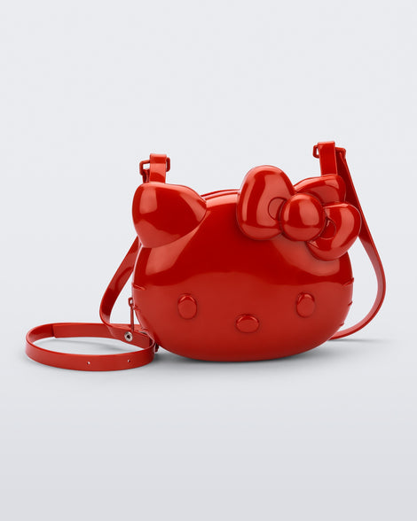 Front view of a red Hello Kitty + Friends Cute Bag with the face of Hello Kitty