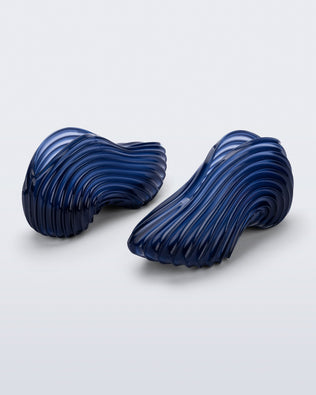 Side and back angled view of a pair of clear blue Quantum Sneakers