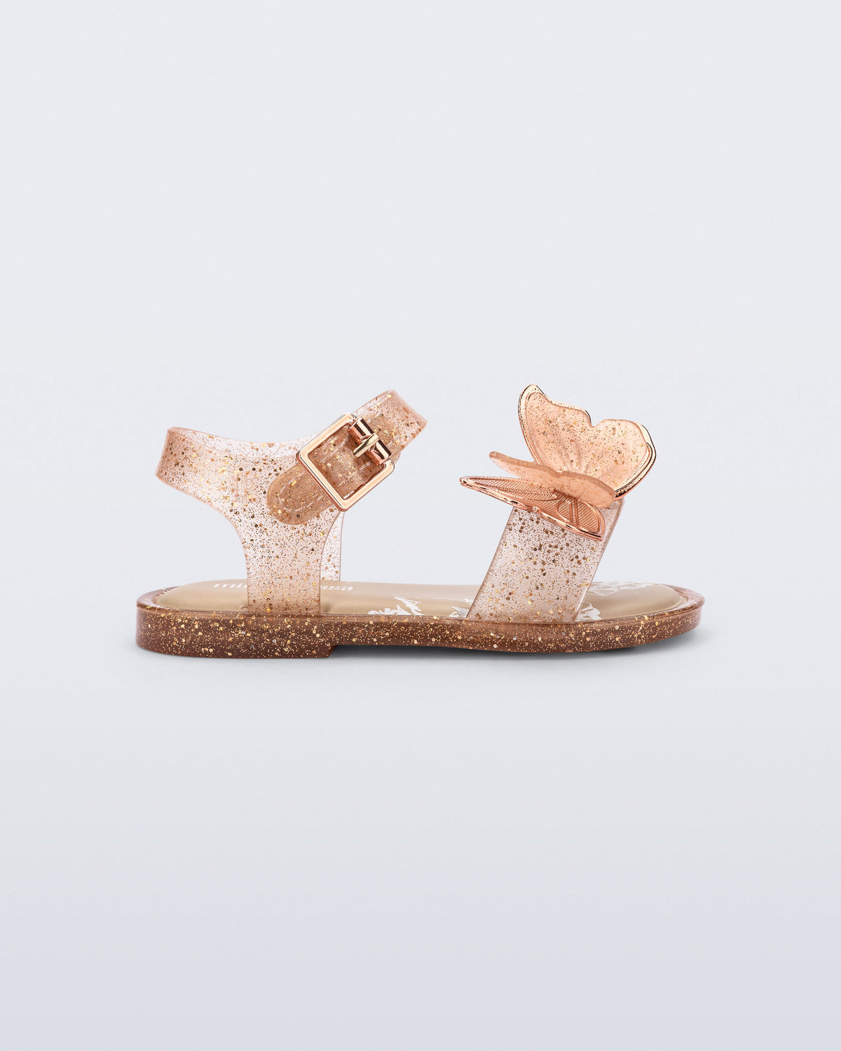 Side view of a glitter beige baby Butterfly Sandals with beige butterfly