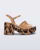 Side view of a brown with animal print sole Lina platform heel