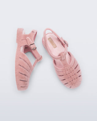 Top and side view of a pair of pink fuzzy Possession Warm fisherman sandals with fuzzy insoles
